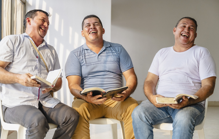 happy three men holding their Biles